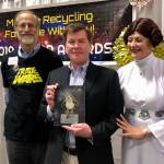 John Logan, center, of Juneaus Litter Free, Inc., holds the 2018 Outstanding Youth Litter Patrol award. (Courtesy Photo)