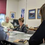 City and Borough of Juneau and Juneau School District Joint Facilities Committee members review findings about space for child care programs in Juneau Schools. (Ben Hohenstatt | Juneau Empire)