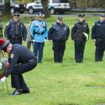 In this May 11, 2018 photo, Juneau Police Department Officers Michael Wise, left, and Jeff Brink place a wreath in front of the grave of Officer Richard James Adair at Evergreen Cemetery as part of Alaskas Police Memorial Ceremonies. Juneau Police Department officers Adair and Jimmy Earl Kennedy died in the line of duty on April 17, 1979. (Michael Penn | Juneau Empire File)