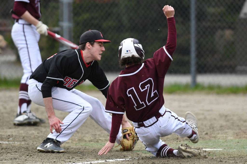 Ketchikans Terik Brown steals home to score against Juneau-Douglas Rawson Olin in the second inning at Adair-Kennedy Memorial Park on Friday, May 10, 2019. (Michael Penn | Juneau Empire)