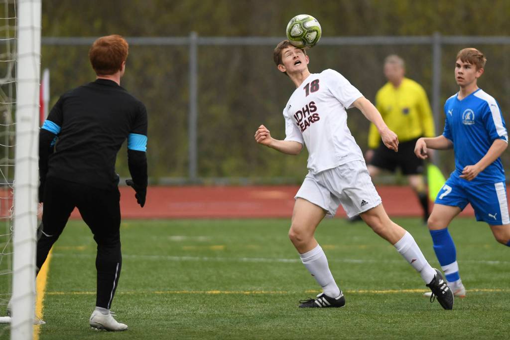 Juneau-Douglass Clem Taylor-Roth heads the ball against Thunder Mountain at TMHS on Tuesday, May 14, 2019. JDHS won 5-1. (Michael Penn | Juneau Empire)