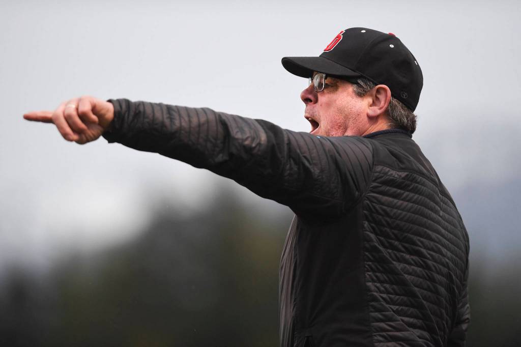 Juneau-Douglas Coach Gary Lehnhart yells instruction to his team against Thunder Mountain at TMHS on Tuesday, May 14, 2019. JDHS won 5-1. (Michael Penn | Juneau Empire)