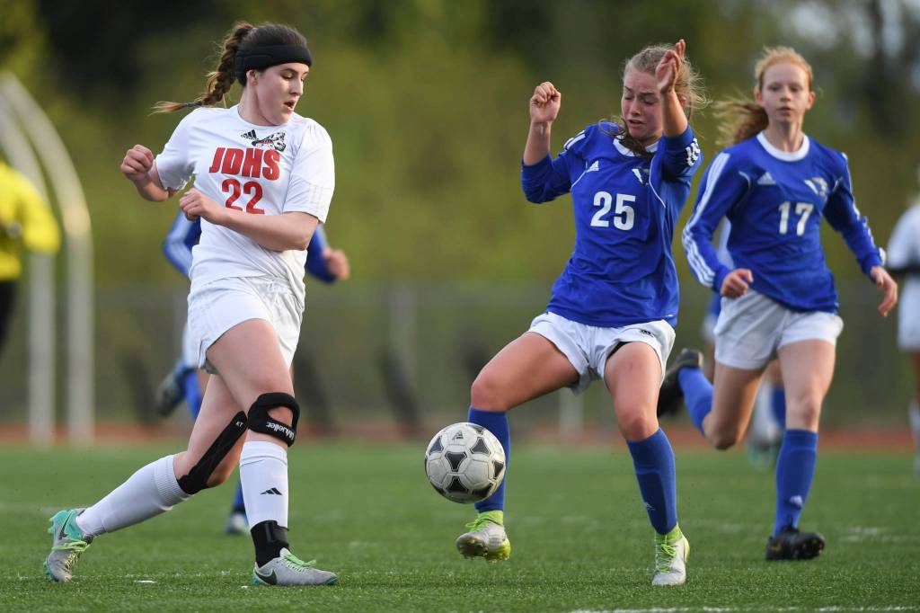 Juneau-Douglas Nikki Box, left, battles with Thunder Mountains Kiah Dihle at TMHS on Tuesday, May 14, 2019. JDHS won 3-0. (Michael Penn | Juneau Empire)
