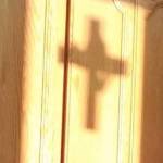 The stained glass cross silhouette reflects at sunset. (Courtesy Photo)