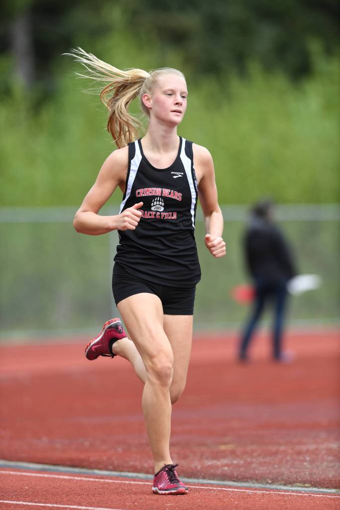 Juneau-Douglas Sadie Tuckwood takes an early lead in the girls 3200-meter run at the Region V Track and Field Championships at Thunder Mountain High School on Friday, May 17, 2019. (Michael Penn | Juneau Empire)