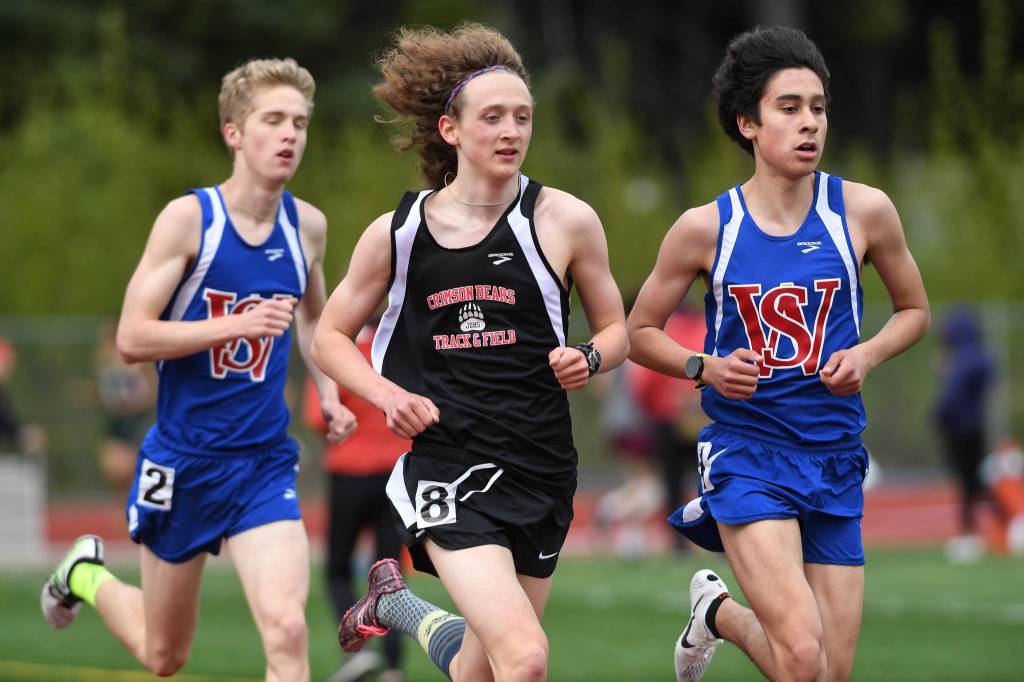 Juneau-Douglas Arne Ellefson-Carnes, center, runs neck and neck with Sitkas Dominic Baciocco, left, and Skylar McIntyre in the boys 3200 meter run at the Region V Track and Field Championships at Thunder Mountain High School on Friday, May 17, 2019. (Michael Penn | Juneau Empire)