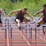 Ketchikans Ivers Credito, right, leads his teammate Christopher Carlson, center, and Juneau-Douglas Tyler Weldon in the boys 110 meter hurdles at the Region V Track and Field Championships at Thunder Mountain High School on Saturday, May 18, 2019. (Michael Penn | Juneau Empire)