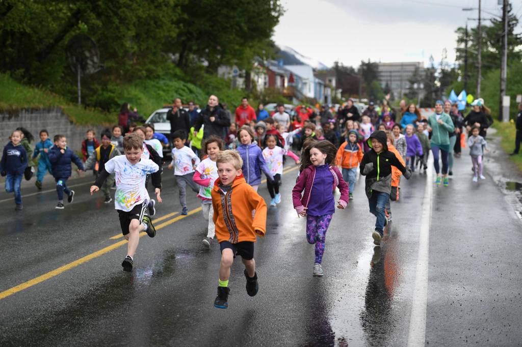 Harborview Elementary School students start the annual Fun Run along Glacier Avenue on Friday, May 17, 2019. Students from Montessori Borealis also ran the three-mile course. (Michael Penn | Juneau Empire)