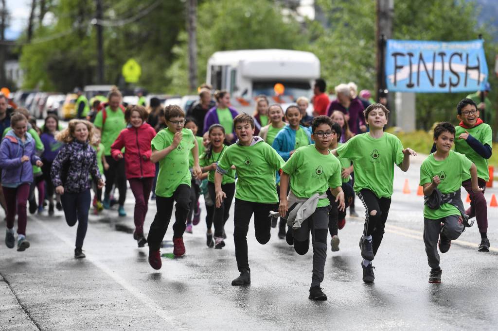 Harborview Elementary School holds its annual Fun Run along Glacier Avenue on Friday, May 17, 2019. Students from Montessori Borealis also ran the three-mile course. (Michael Penn | Juneau Empire)