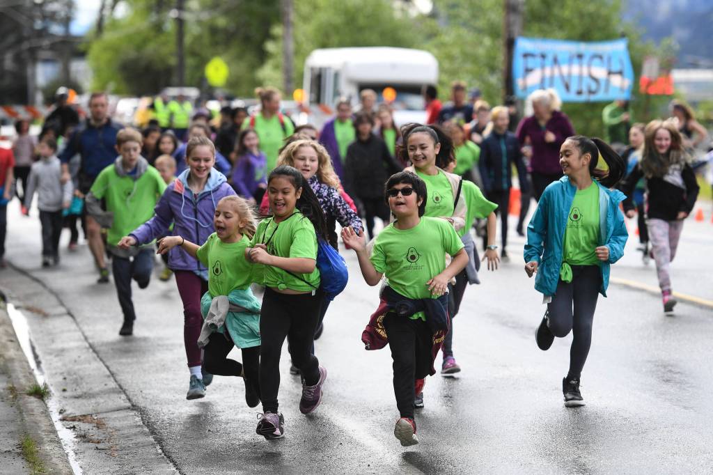 Harborview Elementary School holds its annual Fun Run along Glacier Avenue on Friday, May 17, 2019. Students from Montessori Borealis also ran the three-mile course. (Michael Penn | Juneau Empire)