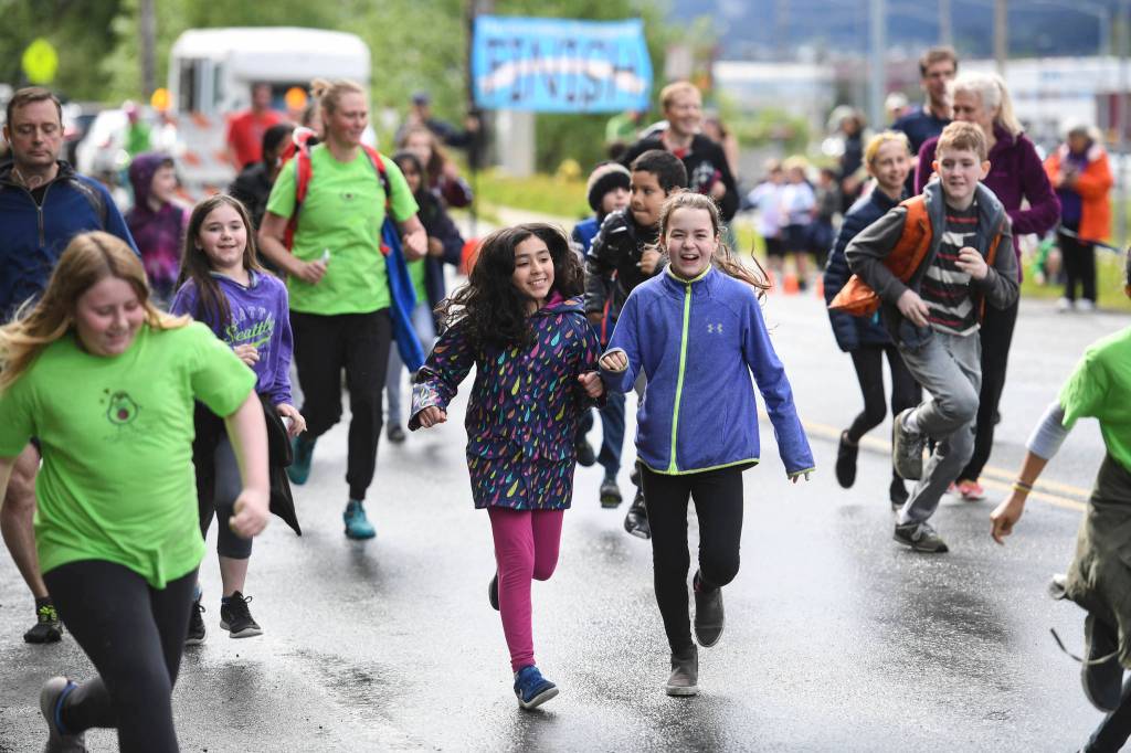 Harborview Elementary School holds its annual Fun Run along Glacier Avenue on Friday, May 17, 2019. Students from Montessori Borealis also ran the three-mile course. (Michael Penn | Juneau Empire)