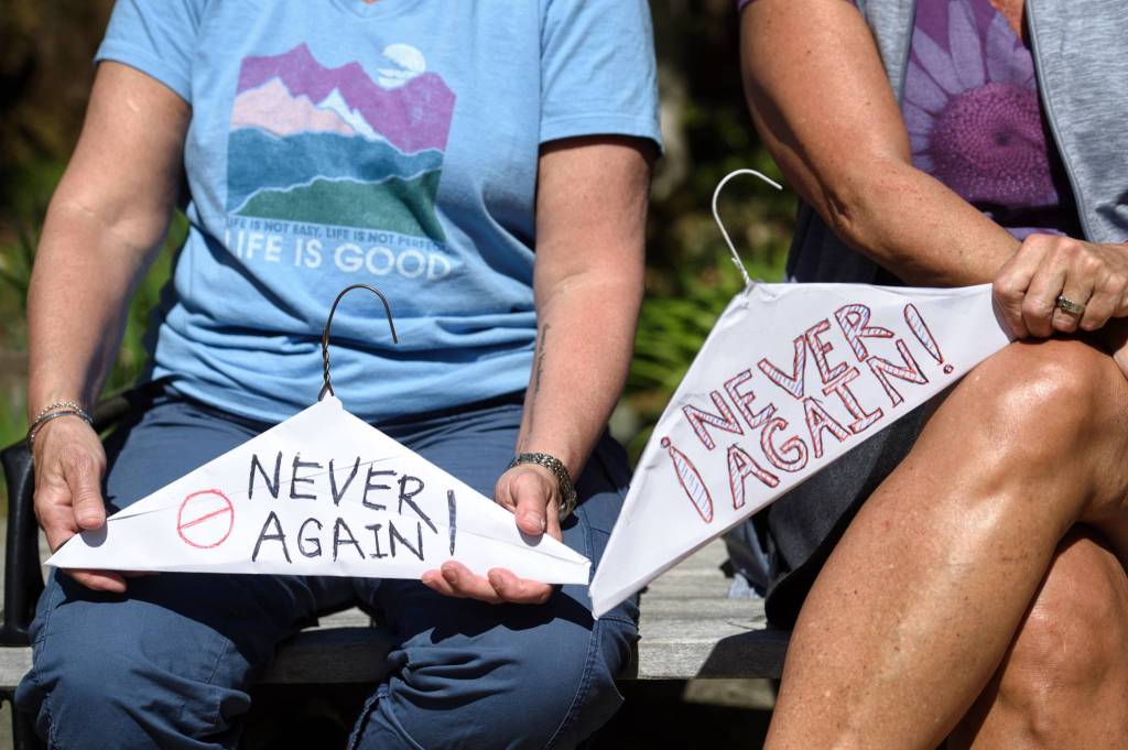 Women attend a rally against anti-abortion laws, wait for the rally to start at the Dimond Courthouse Plaza on Tuesday, May 21, 2019. (Michael Penn | Juneau Empire)