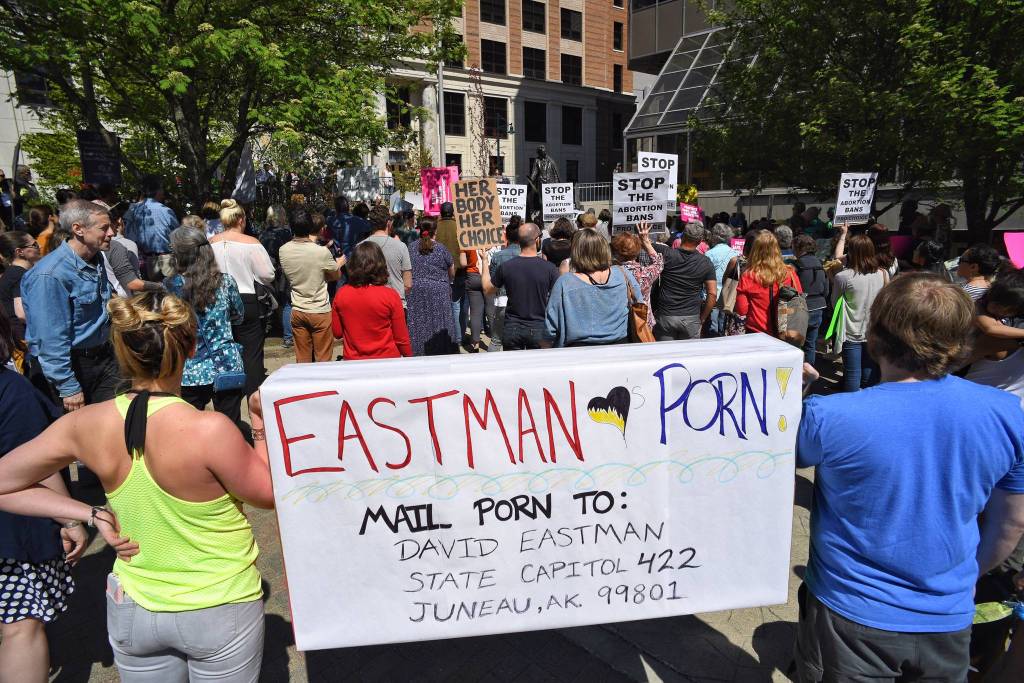 People attend a rally against anti-abortion laws at the Dimond Courthouse Plaza on Tuesday, May 21, 2019. (Michael Penn | Juneau Empire)
