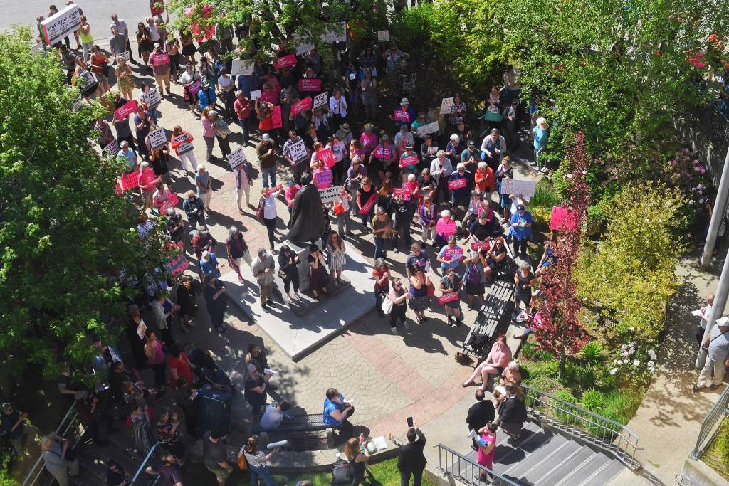 People attend a rally against anti-abortion laws at the Dimond Courthouse Plaza on Tuesday, May 21, 2019. (Michael Penn | Juneau Empire)