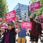 People attend a rally against anti-abortion laws at the Dimond Courthouse Plaza on Tuesday, May 21, 2019. (Michael Penn | Juneau Empire)