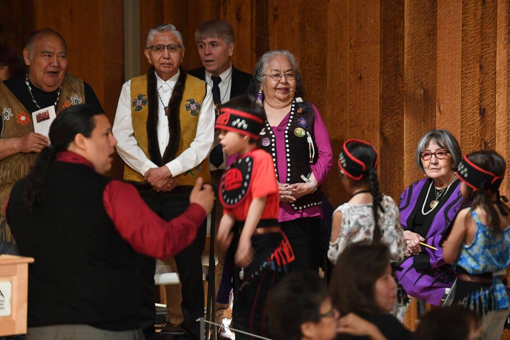 Elders watch as students in the Tlingit Culture Language & Literacy 5th Grade Promotion held in the clan house at the Walter Soboleff Center on Wednesday, May 22, 2019. (Michael Penn | Juneau Empire)