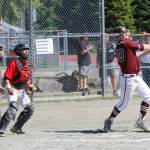 Ketchikans Wyatt Barajas watches a grand slam home run off his bat in the Region V title game on Saturday, May 25, 2019. (Alex McCarthy | Juneau Empire)