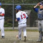 Sitkas Isaac Roth, left, and Morgan Simic score on a dropped infield pop-up by Thunder Mountain during the Region V Baseball Championship at Adair-Kennedy Memorial Park on Friday, May 24, 2019. (Michael Penn | Juneau Empire)