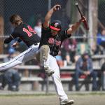 Juneau-Douglas Kona Ogoy, right, celebrates with teammate Austin McCurley after scoring the go-ahead run in the seventh inning against Ketchikan during the Region V Baseball Championship at Adair-Kennedy Memorial Park on Friday, May 24, 2019. (Michael Penn | Juneau Empire)