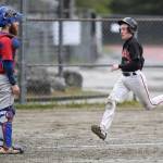 Juneau-Douglas Carter Walker races for home plate on a double by Luis Mojica in the second inning as Sitkas catcher Morgan Simic waits for the ball during the Region V Baseball Championship at Adair-Kennedy Memorial Park on Thursday, May 23, 2019. (Michael Penn | Juneau Empire)