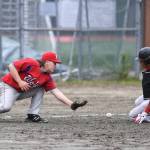 Juneau-Douglas Luis Mojica, right, slides safely into third base as Sitkas Trevin Carley bobbles the throw during the Region V Baseball Championship at Adair-Kennedy Memorial Park on Thursday, May 23, 2019. (Michael Penn | Juneau Empire)