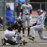 Ketchikans CJ Paula is tagged out at home by Juneau-Douglas Brock McCormick during the Region V Baseball Championship at Adair-Kennedy Memorial Park on Friday, May 24, 2019. (Michael Penn | Juneau Empire)
