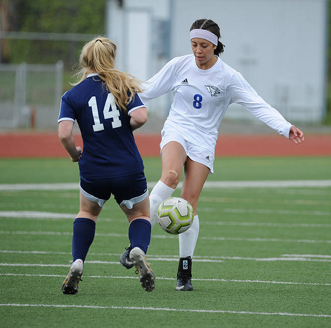 Thunder Mountains Keana Villanueva gets the ball past Homers Daisy Kettle during the ASAA/First National Bank Alaska soccer state championships at Eagle River High School on Thursday, May 23, 2019. TMHS won 1-0. (Michael Dinneen | For the Juneau Empire)