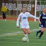 Thunder Mountains Kiah Dihle dribbles between Homer defenders Jessica Sonnen, left, and Sela Weisser during the ASAA/First National Bank Alaska soccer state championships at Eagle River High School on Thursday, May 23, 2019. TMHS won 1-0. (Michael Dinneen | For the Juneau Empire)