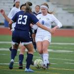 Thunder Mountains Sally Thompson encounters Homers Kimberly Lynn during the ASAA/First National Bank Alaska soccer state championships at Eagle River High School on Thursday, May 23, 2019. TMHS won 1-0. (Michael Dinneen | For the Juneau Empire)