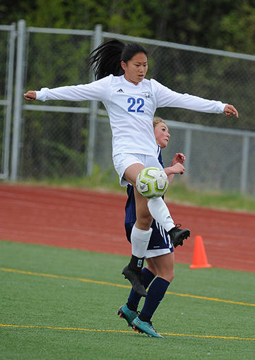 Thunder Mountains Molly Brocious elevates over a Homer defender during the ASAA/First National Bank Alaska soccer state championships at Eagle River High School on Thursday, May 23, 2019. TMHS won 1-0. (Michael Dinneen | For the Juneau Empire)