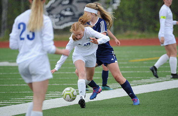 Thunder Mountains Julia Robinson tangles with a Homer defender during the ASAA/First National Bank Alaska soccer state championships at Eagle River High School on Thursday, May 23, 2019. TMHS won 1-0. (Michael Dinneen | For the Juneau Empire)                                Thunder Mountains Julia Robinson tangles with a Homer defender during the ASAA/First National Bank Alaska soccer state championships at Eagle River High School on Thursday, May 23, 2019. TMHS won 1-0. (Michael Dinneen | For the Juneau Empire)