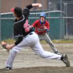 Sitkas base runner Brayden Massey-Jones watches as Juneau-Douglas Garrett Bryant pitches in the first inning during the Region V Baseball Championship at Adair-Kennedy Memorial Park on Thursday, May 23, 2019. JDHS won 6-5. (Michael Penn | Juneau Empire)