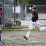 Juneau-Douglas Carter Walker races for home plate on a double by Luis Mojica in the second inning as Sitkas catcher Morgan Simic waits for the ball during the Region V Baseball Championship at Adair-Kennedy Memorial Park on Thursday, May 23, 2019. JDHS won 6-5. (Michael Penn | Juneau Empire)