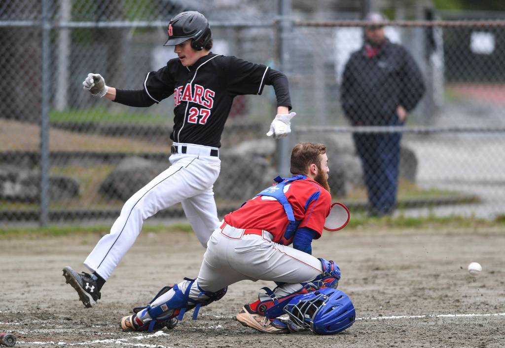 Juneau-Douglas scores in front of the throw to Sitkas catcher Morgan Simic in the fourth inning during the Region V Baseball Championship at Adair-Kennedy Memorial Park on Thursday, May 23, 2019. JDHS won 6-5. (Michael Penn | Juneau Empire)