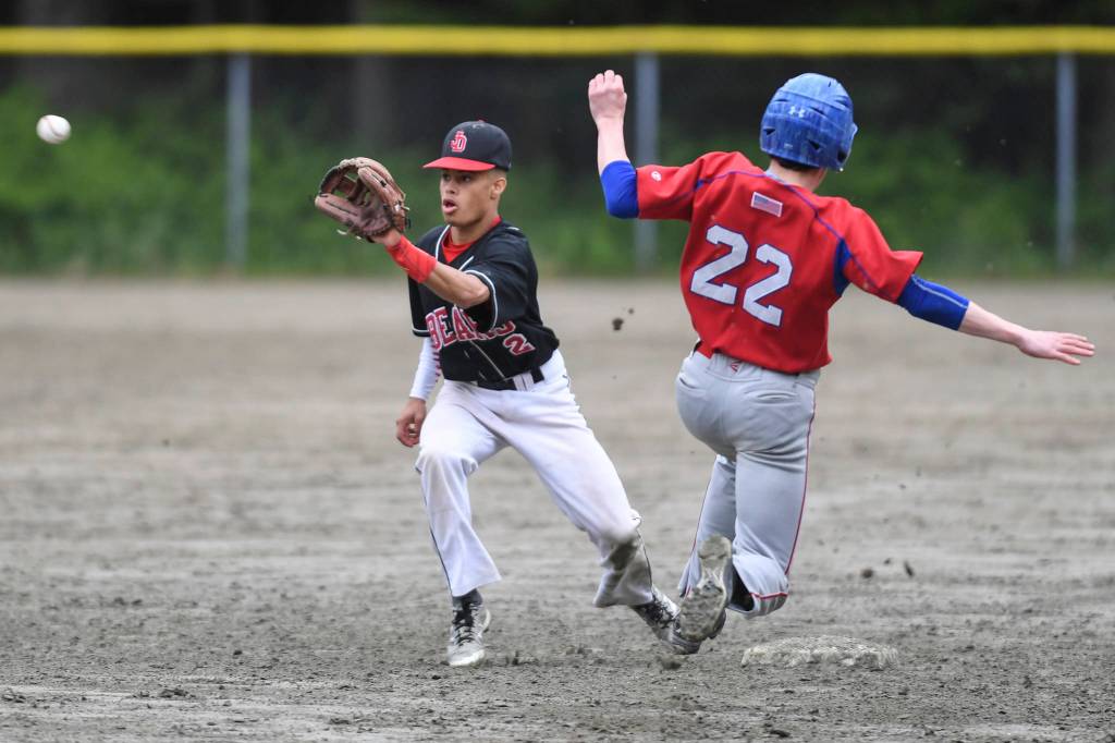 Sitkas Michael Leach, right, beats the throw to Juneau-Douglas Gaby Soto to steal second base during the Region V Baseball Championship at Adair-Kennedy Memorial Park on Thursday, May 23, 2019. JDHS won 6-5. (Michael Penn | Juneau Empire)