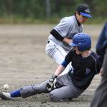 Petersburgs Thomas Durkin slides safely into second base in the sixth inning as the ball gets away from Thunder Mountains Oliver Mendoza during the Region V Baseball Championship at Adair-Kennedy Memorial Park on Thursday, May 23, 2019. Petersburg won 4-1. (Michael Penn | Juneau Empire)