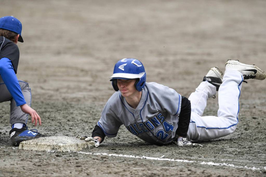 Thunder Mountains Josh Carte to forced to dive back to first base against Petersburg during the Region V Baseball Championship at Adair-Kennedy Memorial Park on Thursday, May 23, 2019. Petersburg won 4-1. (Michael Penn | Juneau Empire)