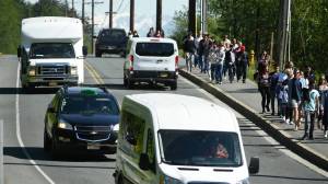 Visitors from the Norwegian Bliss walk along Thane Road to downtown on Tuesday, May 21, 2019. (Michael Penn | Juneau Empire)
