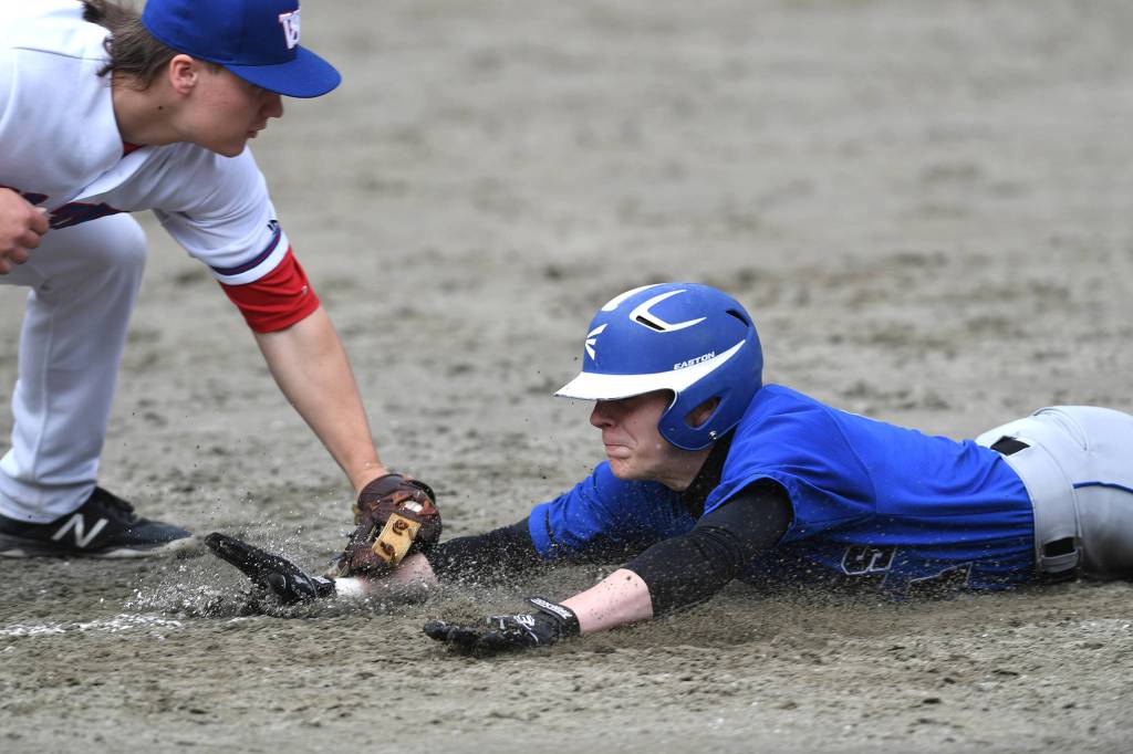 Thunder Mountains Chase Foster gets caught off base by Sitkas Trevin Carley during the Region V Baseball Championship at Adair-Kennedy Memorial Park on Friday, May 24, 2019. TMHS lost 1-7. (Michael Penn | Juneau Empire)