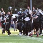 Legends players celebrate their first touchdown at the Juneau Alumni Football Game with football players, dance team members and cheerleaders from Juneau-Douglas and Thunder Mountain High Schools at Adair-Kennedy Memorial Field on Friday, May 24, 2019. (Michael Penn | Juneau Empire)