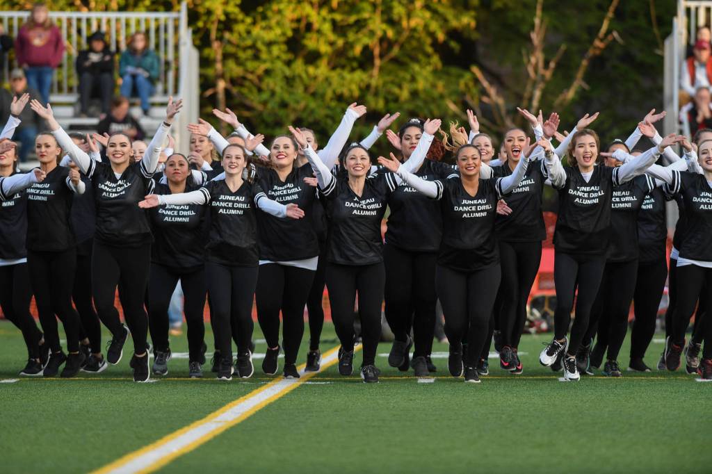 Members of the Juneau Alumni Dance Team perform during halftime of the Juneau Alumni Football Game with football players, dance team members and cheerleaders from Juneau-Douglas and Thunder Mountain High Schools at Adair-Kennedy Memorial Field on Friday, May 24, 2019. (Michael Penn | Juneau Empire)