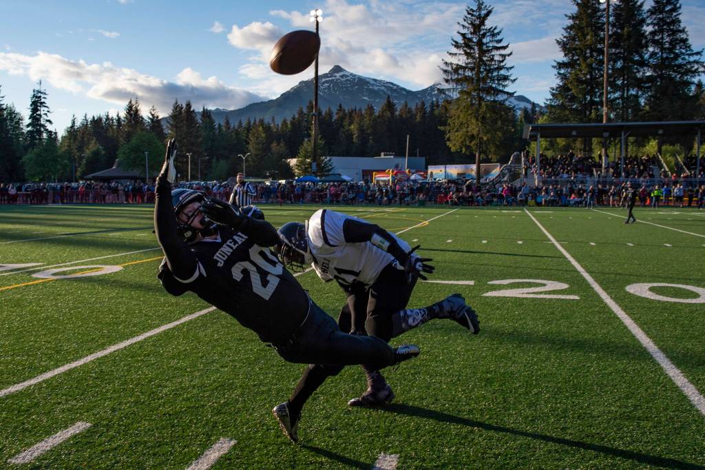 Legends Willy Dodd makes a catch that was ruled out of bounds during the Juneau Alumni Football Game with football players, dance team members and cheerleaders from Juneau-Douglas and Thunder Mountain High Schools at Adair-Kennedy Memorial Field on Friday, May 24, 2019. (Michael Penn | Juneau Empire)