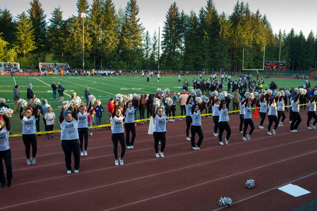 Scenes from the Juneau Alumni Football Game with football players, dance team members and cheerleaders from Juneau-Douglas and Thunder Mountain High Schools at Adair-Kennedy Memorial Field on Friday, May 24, 2019. (Michael Penn | Juneau Empire)