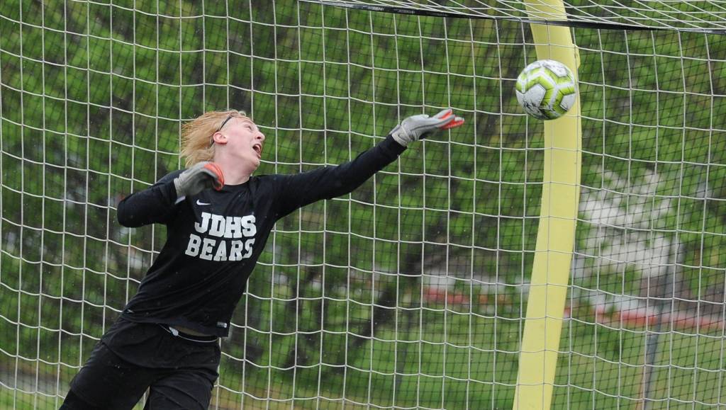 Juneau-Douglas goalie Tad Watson reaches in vain for Kenais tying goal late in regulation during their ASAA/First National Bank Alaska soccer state championship match Saturday afternoon at Service High School in Anchorage. (Michael Dinneen | For the Juneau Empire)