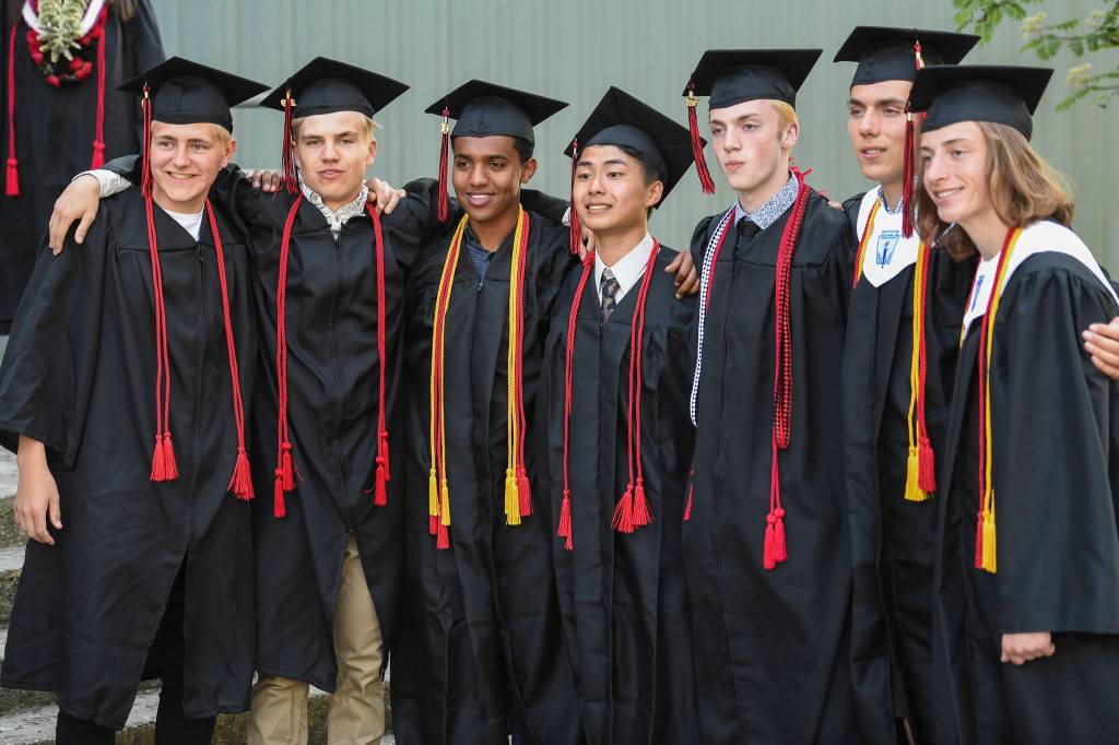 Juneau-Douglas High School: Yadaa.at Kalé pose for pictures with each other before the graduation ceremony on Sunday, May 26, 2019. (Michael Penn | Juneau Empire)