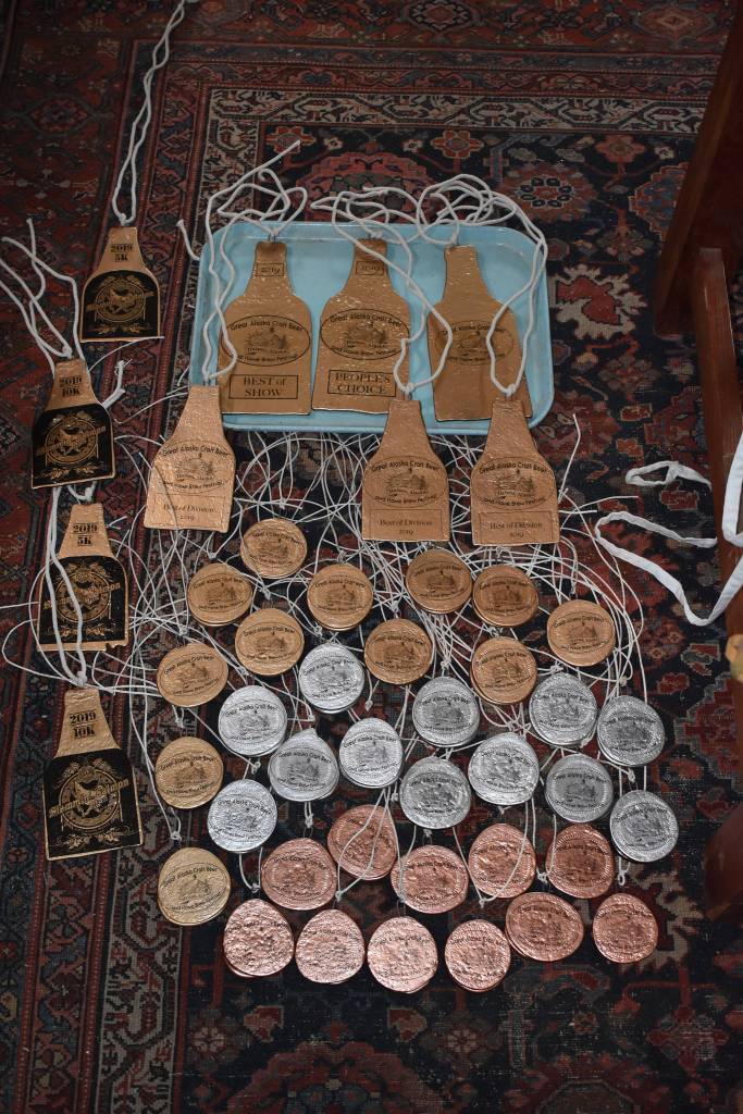 Juneau artist Rachael Juzeler, a former brewer, makes medals for the Great Alaska Craft Beer and Homebrew Festival using a glass kiln and old Alaskan Brewing Co. bottles. (Courtesy Photo | Rachael Juzeler)