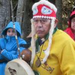 George Digger Dalton Jr. stands in regalia during a ground breaking and ground blessing ceremony at the site of a new dock being built at Icy Strait Point near Hoonah, May 1, 2019. (Ben Hohenstatt | Juneau Empire)