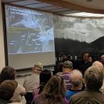 Civil engineer Brandon Ivanowicz points at a slide displaying a proposal for a fish cleaning float during a meeting, Thursday May 30, 2019. (Ben Hohenstatt | Juneau Empire)