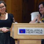 Tlingit weavers Anastasia Shaawaat Ku Gei Hobson-George and Lily Hope talk about a pair of Chilkat dance leggings they made during the Our Grandmothers Wealth presentation Friday, May 31, 2019. The event was an introduction of a new piece of art and a close to Hobson-Georges apprenticeship. (Ben Hohenstatt | Juneau Empire)