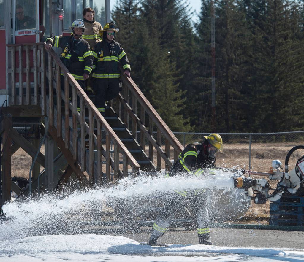 Airport Rescue Firefighter Jason Tarver takes a foam sample as southeast firefighters update their airport rescue firefighting skills at the Hagevig Regional Fire Training Center on Thursday, April 13, 2017. (Michael Penn | Juneau Empire File)                                Airport Rescue Firefighter Jason Tarver takes a foam sample as southeast firefighters update their airport rescue firefighting skills at the Hagevig Regional Fire Training Center on Thursday, April 13, 2017. (Michael Penn | Juneau Empire File)